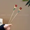 Horquilla roja con un toque de alta gama, nuevo estilo chino, horquilla recubierta de esmalte para llevar con un cheongsam, un accesorio elegante para recogidos de mujer