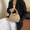 Bolso pequeño de alta gama estilo extranjero para mujer 2025 nueva moda explosión todo-partido bandolera bolsa redonda pequeña repujada