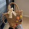 Bolsas tejidas hechas a mano de verano para mujer 2026 Nueva moda Bolso cruzado de paja para mujer Vacaciones en la playa Bolso cubo portátil