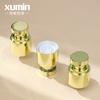 Botella de vacío personalizada Xumin de oro galvanizado de 15-30 ml como subbotella, botella de loción de esencia transparente de 40-50 ml.