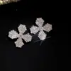 Novo produto transfronteiriço europeu e americano: Brincos de franja de flor oca com detalhes em diamante, sensação de luxo leve e de alta qualidade, brincos femininos modernos e versáteis