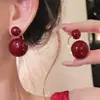 Pendientes de bola redonda roja Ankora, Lujo ligero, Pendientes exquisitos y de alta gama, Pendientes de nicho modernos y elegantes para mujer