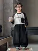 Pantalones Infantiles de Primavera y Otoño 2026 Nuevo Estilo Pantalones de Punto de Otoño para Niños Pantalones Deportivos Casuales Curvos Pantalones de Moda