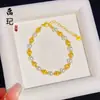 Pulsera de cuentas de ojo de gato brillante color arena dorada estilo joyería para mujer, moderna, de lujo ligero, versátil, pulsera de perlas al por mayor