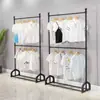 Perchero de ropa de hierro de doble varilla de pie de doble capa para exhibición en tienda de ropa, colgador de falda a cuadros JK para uso doméstico, simple, ajustable, económico