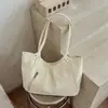 Bolso tote minimalista de estilo coreano con estampado de leopardo, nuevo para 2026, un bolso de hombro elegante y espacioso para el trabajo y los desplazamientos, también adecuado como bolso de axila