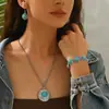 Venta Caliente Transfronteriza Europea y Americana Estilo Étnico Elementos Mongoles Patrón de Textura Propicia Colgante Turquesa Conjunto de Collar y Pendientes