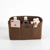 Bolsas de fieltro personalizables transfronterizas, incluyendo bolsas de tocador de fieltro y bolsas de almacenamiento multiusos, son artículos de gran venta para los mercados transfronterizos