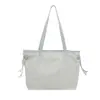 Bolso Tote de Hombro Simple para Mujer de Color Sólido, Gran Capacidad, Nuevo Verano 2025, Casual, Textura, Trabajo con Colgante, Viajero, Sencillo