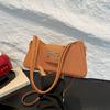 Bolsa baguette de laço estilo estrangeiro para poucas pessoas de alto valor 2025 nova coleção de primavera bolsa feminina moda ombro casual bolsa de axila