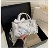 Bolsa de mão feminina de alta qualidade e tendência transfronteiriça, novo modelo 2026, bolsa quadrada pequena requintada super popular, bolsa de ombro com corrente de mão
