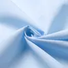 Un gran número de tela médica resistente al cloro, a la transpiración y al blanqueo, 202 + tela lisa de algodón y poliéster de alta calidad, color gris azul claro