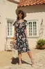 Producto Nuevo Transfronterizo 2025 Verano Europeo y Americano Nuevo Vestido de Playa con Estampado de Dobladillo Ancho, Cuello en V, Cintura Alta, Manga Corta, Vestido de Gasa