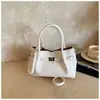 Bolso Cubo Retro Casual Transfronterizo para Mujer 2026 Modelo Nuevo Gran Capacidad Simple Hombro Viajero Axila Cruzado