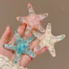 Pinza para el pelo de estrella de mar estéreo dulce y genial estilo coreano clip de pico de pato para vacaciones en la playa clip lateral para flequillo de chica dulce