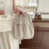 Conjunto de Verano para Niñas 2026 Nuevo Elegante Tejido Calado de Manga Corta Pantalones de Secado Rápido para Niños Conjunto de Dos Piezas