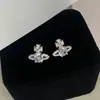 Pendientes de Saturno Ovalados de Circonita Plateada Estilo Francés de Lujo Ligero Pendientes de Alto Nivel Pendientes de Moda con Sentido de Diseño de Nicho