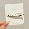Lindo pasador de pelo de gatito negro, moderno y versátil para mujeres, perfecto para sujetar el flequillo y el cabello lateral, con un diseño de pinza de pico de pato de alta gama