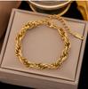 Pulseira de aço inoxidável de alta qualidade, nicho, não desbota, best-seller transfronteiriça, para menina, corda vermelha Pérola, pulseira de Trevo, joia