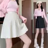 Roupas de maternidade para outono e inverno, nova saia de tricô sem suporte para a barriga, não restritiva, casual, emagrecedora, plissada em A, justa nos quadris, curta