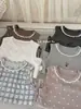 87018 Conjunto de Roupa de Casa para Meninas 2026 Nova Coleção Início da Primavera Conjunto de Duas Peças com Body e Shorts de Tricô Respirável e Absorvente