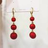 Pendientes de perlas rojas de moda con atmósfera roja de Año Nuevo que combinan con todo, pendientes retro exquisitos de alta calidad, joyería de oreja simple