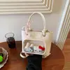 Bolso de mano estilo coreano transfronterizo, nuevo modelo 2026 para niñas, bolso tipo cubo simple, alto valor estético, bolso cruzado versátil
