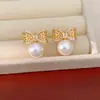 Pendientes de botón redondos de perla con lazo y circonita de aguja plateada, exquisitos y versátiles, sensación de lujo ligero y alta gama, pendientes al por mayor