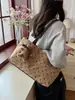 Bolso de mano, bolso de hombro y bolso de axila nuevo estilo coreano, de nicho y exquisito para el trabajo, con diseño de bolsa tote de lunares para mujer, 2026