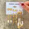 Set de pendientes de perla retorcida dorada estilo europeo y americano, pendientes metálicos geométricos en forma de C, pendientes para mujer de alta gama y únicos