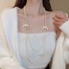 Nuevo collar de perlas artificiales de doble capa apiladas, exquisita cadena de clavícula de moda transfronteriza, elegante cadena de lana ligera de lujo francesa