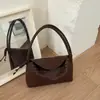 Bolso de axila de textura tejida de alta gama para mujer, nuevo y moderno para el verano 2026, color caramelo, versátil, bolso de mano tipo cesta