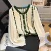 Camisa de Chiffon Doce Francesa Falsa Duas Peças Feminina Malha com Renda Patchwork Jacquard Emagrecedora Estilo Curto 2026 Primavera/Outono