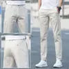 Pantalones casuales de verano nuevos, pantalones para hombre estilo K, pantalones modernos holgados de pierna recta para jóvenes, de algodón puro elástico color blanco hueso para hombre