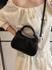 Bolso de mano vertical a rayas texturizado transfronterizo para mujer, nuevo modelo 2025, diseño de nicho, elegante y versátil, de hombro y cruzado, al por mayor