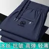 Pantalones rectos de verano de alta elasticidad transfronterizos para hombres jóvenes y de mediana edad, nuevos pantalones largos casuales de seda helada para hombre con sensación fresca, talla grande