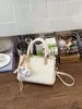 Bolsa de Palha Tecida para Mulheres 2026 Nova Coleção Primavera e Verão Moda de Nicho Bolsa de Ombro Único Transversal Bolsa Bonita da Moda para Meninas