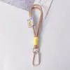 Muñeca de Cuerda Trenzada Llavero de Cuerda de Felpa Cadena Doble para Teléfono Móvil Mosquetón de Nailon Accesorios Colgantes Hechos a Mano para Teléfono Móvil