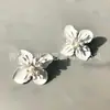 Pendientes nuevos de joyería de moda Qingdao, pendientes sencillos de estilo europeo y americano con forma de flor y pintura colorida, venta al por mayor para mujer