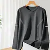 Camiseta casual versátil de manga larga para hombre para otoño, cuello redondo, color liso moderno, cómoda, transpirable y de corte holgado.