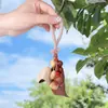 Estilo Bosque Colgante de campanilla de viento de cáscara de fruta natural indonesia Llavero de sanación sonora DIY Colgador de bolsa Colgador de coche Materiales de producto terminado