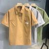 Verano Nuevo Color Sólido Bolsillo Jersey Manga Corta Camiseta de Hombre Marca de Moda Solapa Japonesa Holgada Herramientas Camiseta Top Ropa