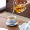 Taza de té de cerámica azul con loto pintado a mano con color de engobe para el hogar taza para degustación de té pu'er juego de té kung fu taza de maestro taza individual