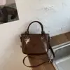 Bolso cubo de moda y sencillo para mujer, gran capacidad, nuevo de la primavera 2026, elegante estilo vintage, para el trabajo y los desplazamientos, bolso de hombro