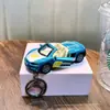 Llavero de coche cool de fricción, divertido llavero colgante de modelo de juguete de motocicleta para aliviar el estrés, al por mayor