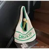 Bolso de Mano Tejido Simple Estilo Coreano Literario para Mujer 2025 Verano Nuevo Retro Hueco con Letra Bolso de Hombro para Axila