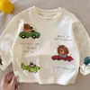 Camiseta infantil de desenho animado, manga longa para meninos, novo estilo primavera e outono 2026, blusa para crianças pequenas, base de algodão puro para bebês, estilosa para meninas