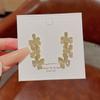 Aretes de botón de pétalos de diamantes completos de aguja de plata 925 Pendientes de moda de lujo ligero para mujer Pendientes versátiles Pendientes de alta gama al por mayor