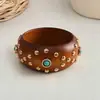 Pulsera redonda de remache de flor de resina y madera transfronteriza europea y americana, pulsera de estilo vintage francés, joyería con sensación de lujo ligero y alta gama