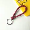 Llavero creativo de cuerda de cuero tejido a mano para pareja, llavero de coche, llavero al por mayor, colgante para bolso